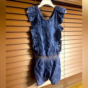 Chambray romper with roller skate print and smocked waist. New with tags.